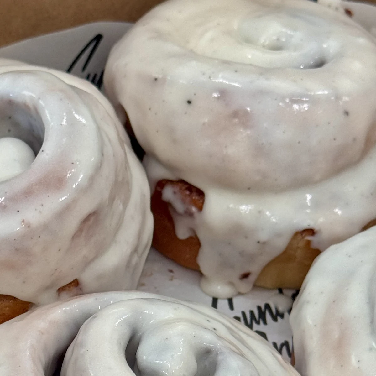 Real Sunday Crumb cinnamon rolls, glazed, in a bakery box